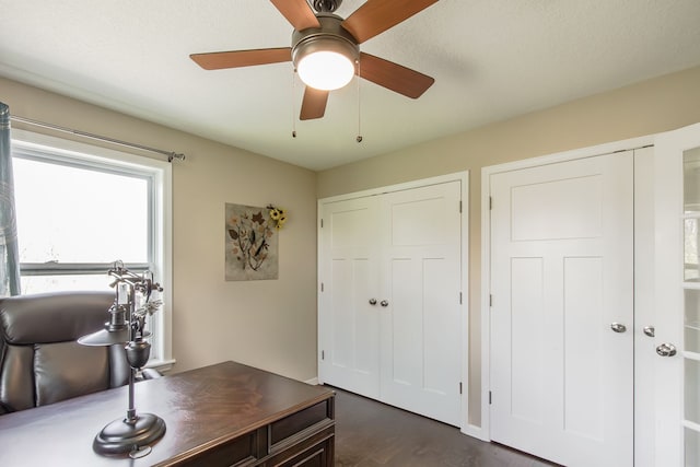10207 Dodge Rd, Otisville, MI 48463 - home office featuring a ceiling fan and dark wood-type flooring