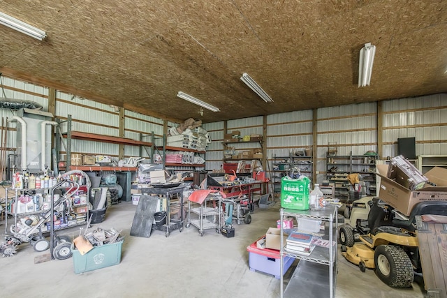 10207 Dodge Rd, Otisville, MI 48463 - garage featuring a workshop area