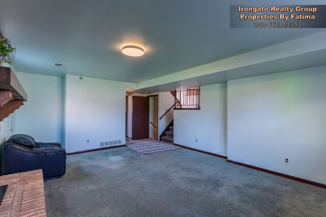 17906 Cider Mill St, Macomb, MI 48044 - unfurnished living room with stairway, carpet floors, and baseboards