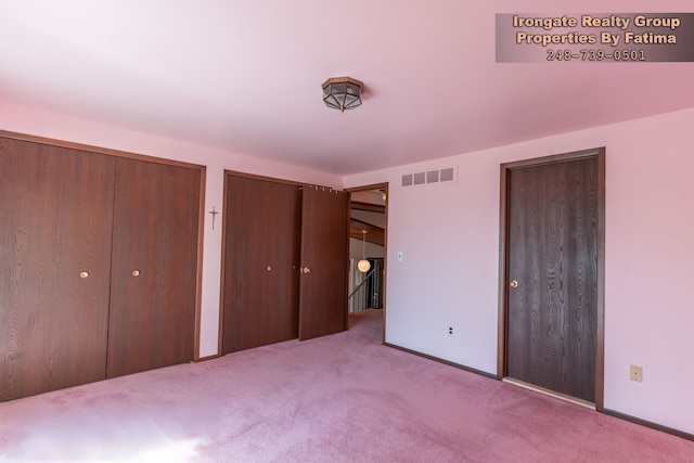 17906 Cider Mill St, Macomb, MI 48044 - unfurnished bedroom featuring two closets, carpet floors, and baseboards