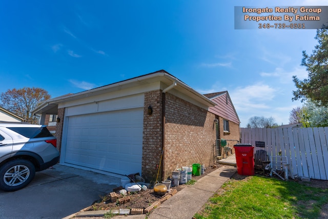 17906 Cider Mill St, Macomb, MI 48044 - view of property exterior featuring brick siding, fence, a garage, and concrete driveway