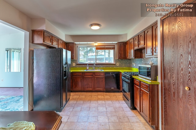 17906 Cider Mill St, Macomb, MI 48044 - kitchen with black appliances, a sink, backsplash, and light stone finish flooring