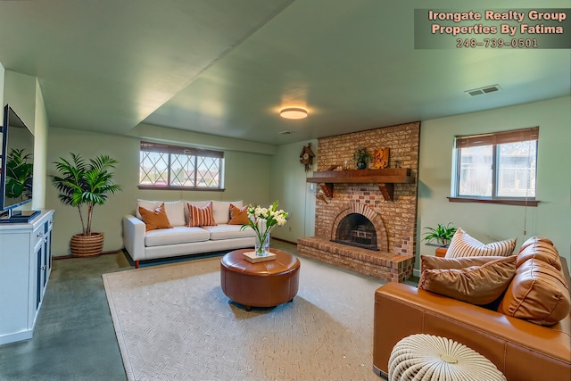 17906 Cider Mill St, Macomb, MI 48044 - living room featuring healthy amount of natural light, a brick fireplace, and baseboards