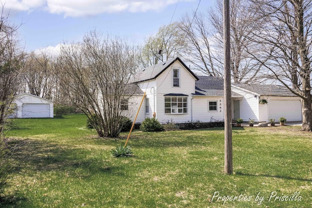 traditional-style home with a shingled roof, a front lawn, and a garage