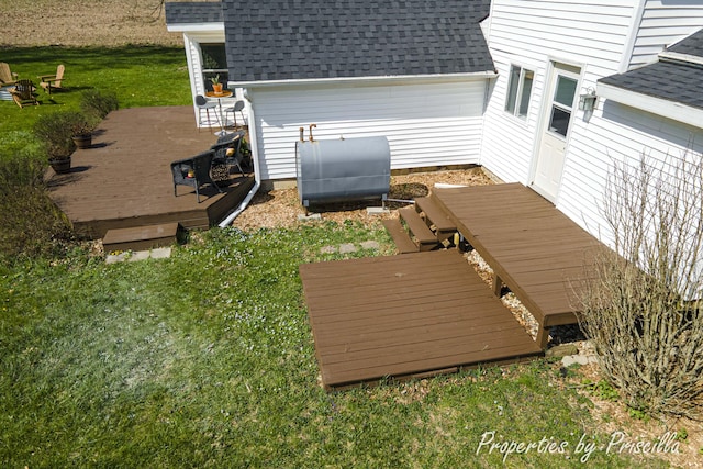 wooden deck with a lawn and heating fuel