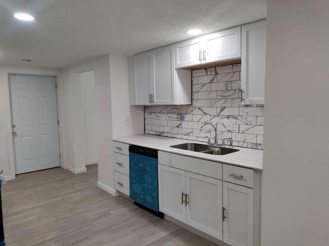 2871 Bailey St, Norton Shores, MI 49444 - kitchen with decorative backsplash, light countertops, dishwasher, and a sink