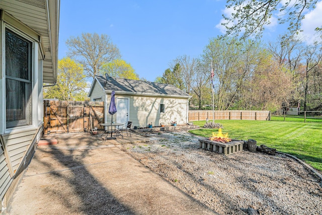 view of patio / terrace with a fire pit, a gate, and a fenced backyard