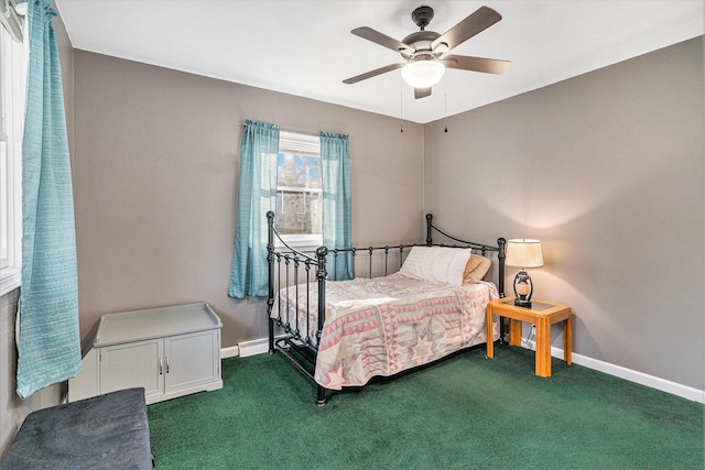 carpeted bedroom featuring ceiling fan and baseboards