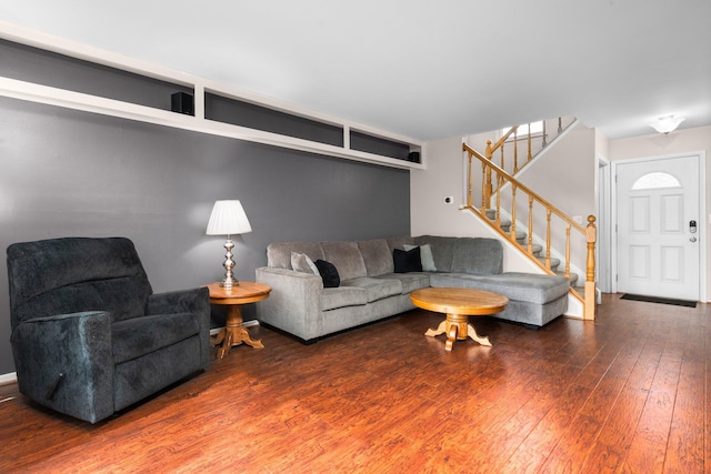 living room with hardwood / wood-style floors and stairs