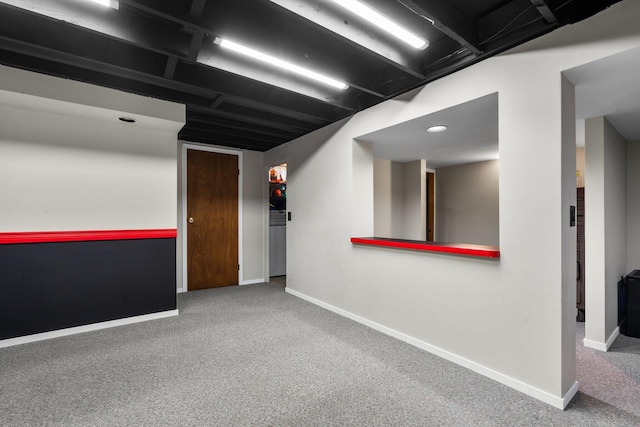 unfurnished room featuring baseboards and carpet floors