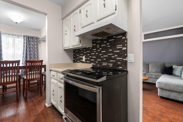 kitchen with white cabinets, range with electric cooktop, dark wood-style flooring, and decorative backsplash