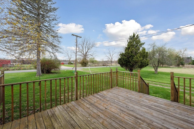 wooden terrace with a yard