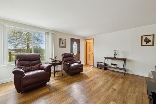sitting room featuring light wood-style floors and baseboards