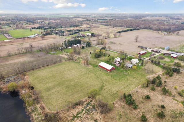 birds eye view of property with a rural view and a water view