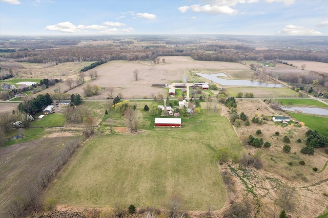 birds eye view of property featuring a rural view and a water view