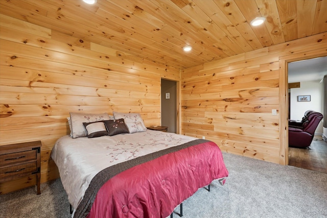 carpeted bedroom featuring wooden ceiling, wooden walls, and recessed lighting