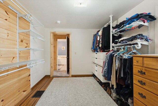 spacious closet with wood finished floors and visible vents