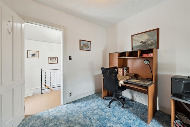 home office featuring baseboards and carpet