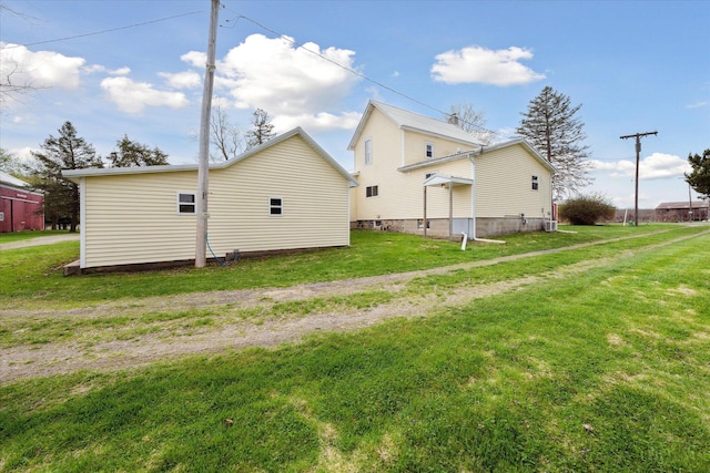 view of property exterior featuring a lawn