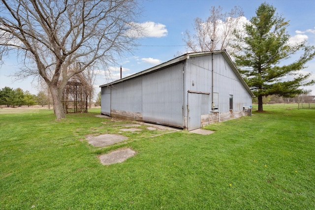 view of pole building with a lawn