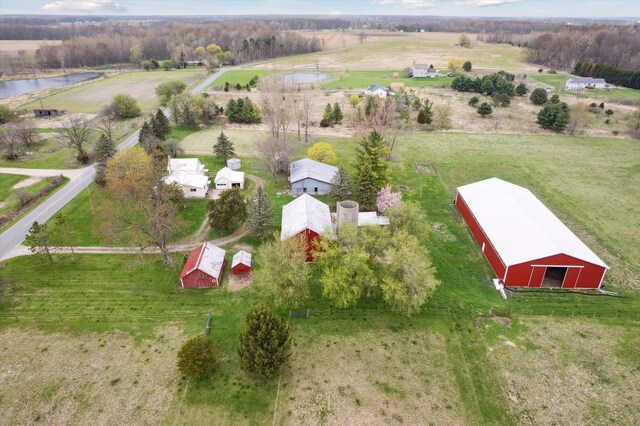 birds eye view of property featuring a rural view and a water view