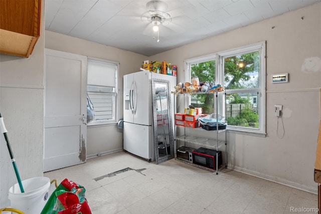 20186 Monte Vista St, Detroit, MI 48221 - kitchen featuring white refrigerator with ice dispenser and ceiling fan