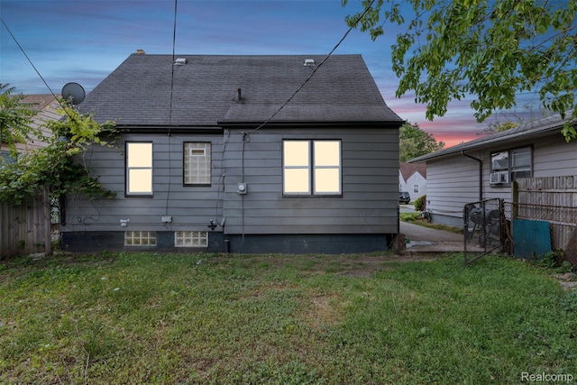 20186 Monte Vista St, Detroit, MI 48221 - back of house at dusk featuring a shingled roof