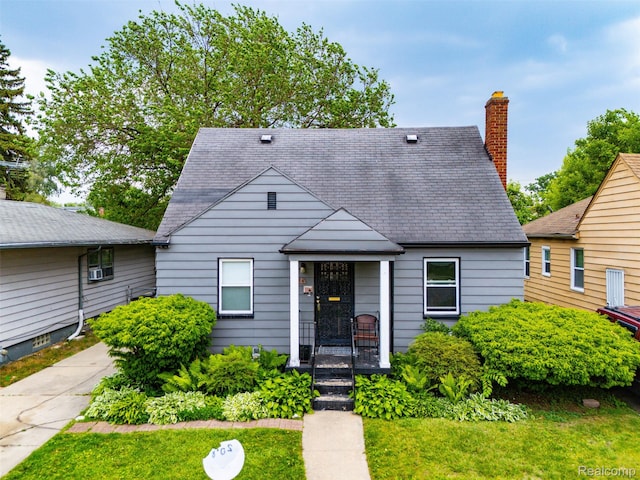 20186 Monte Vista St, Detroit, MI 48221 - view of front of house featuring a chimney, a shingled roof, and a front lawn