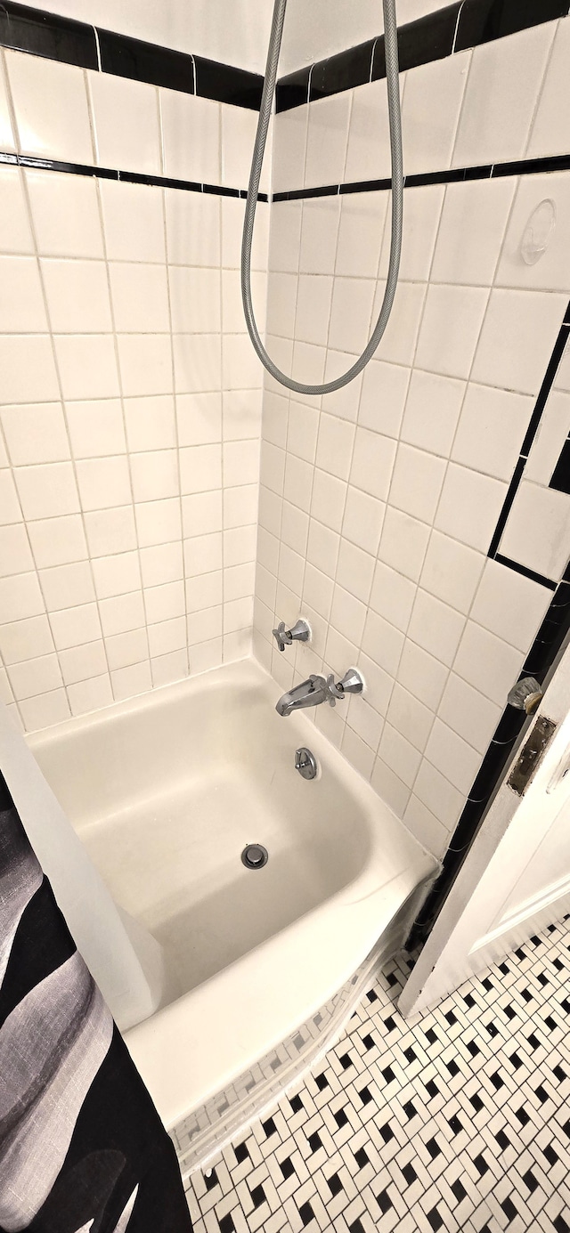 full bathroom featuring tile patterned floors and shower / bathing tub combination