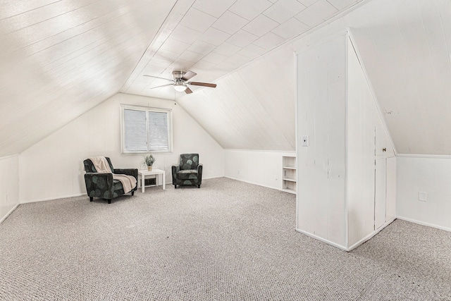 additional living space featuring lofted ceiling, a ceiling fan, baseboards, and carpet floors