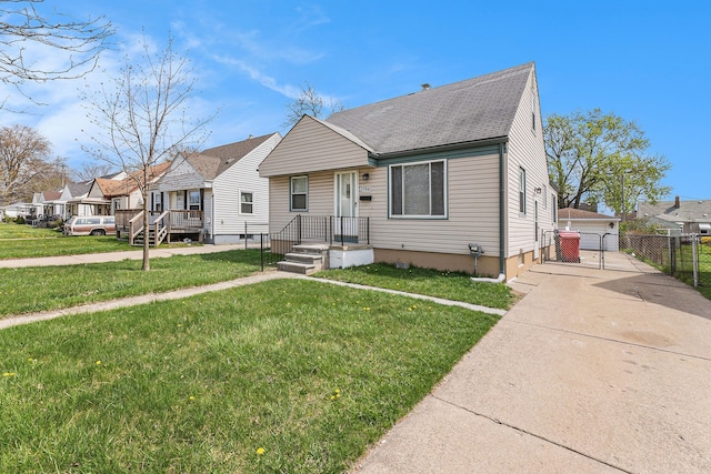 bungalow featuring a residential view, a front yard, fence, and roof with shingles