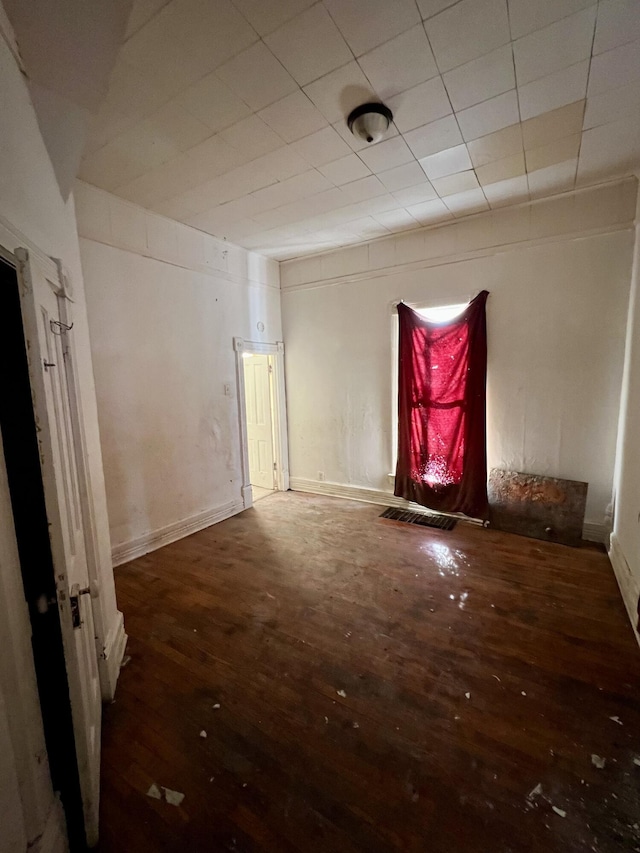 spare room featuring hardwood / wood-style flooring