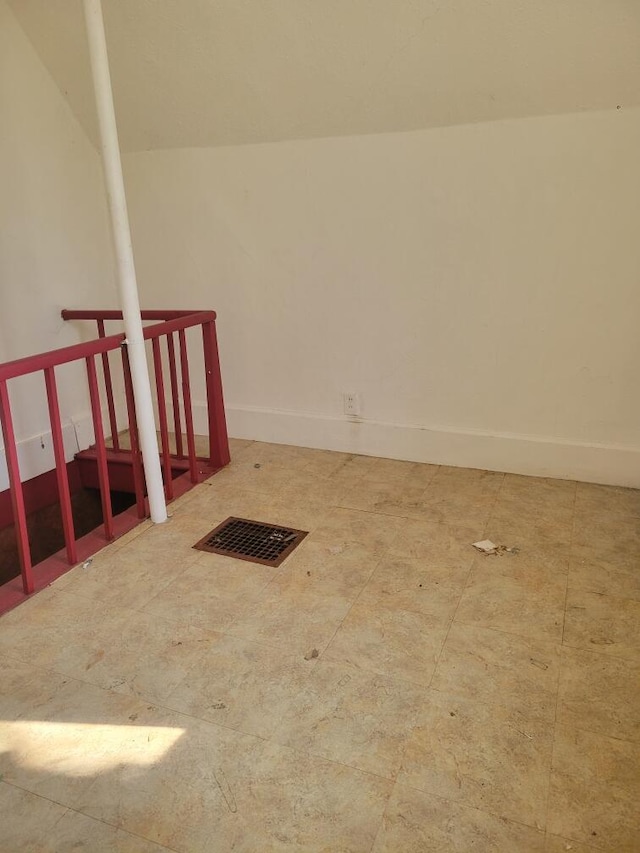 empty room featuring baseboards