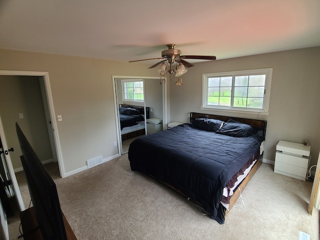 24800 Dayton Rd, Armada, MI 48005 - bedroom with carpet flooring, visible vents, baseboards, a closet, and a ceiling fan