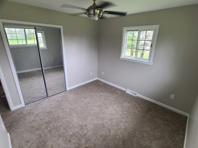 24800 Dayton Rd, Armada, MI 48005 - unfurnished bedroom featuring carpet flooring, visible vents, ceiling fan, a closet, and baseboards