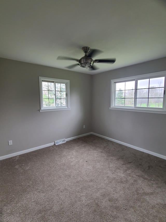 24800 Dayton Rd, Armada, MI 48005 - empty room featuring visible vents, ceiling fan, carpet, and baseboards