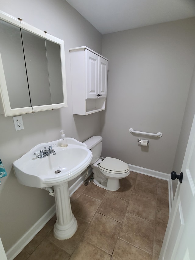 24800 Dayton Rd, Armada, MI 48005 - bathroom with toilet, tile patterned flooring, and baseboards