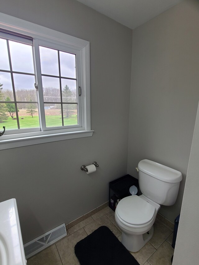 24800 Dayton Rd, Armada, MI 48005 - bathroom featuring visible vents, toilet, tile patterned flooring, and baseboards