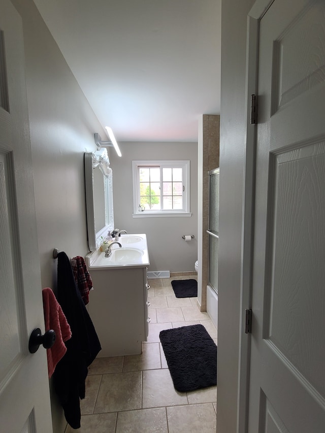 24800 Dayton Rd, Armada, MI 48005 - bathroom with a shower with shower door, tile patterned floors, toilet, vanity, and baseboards