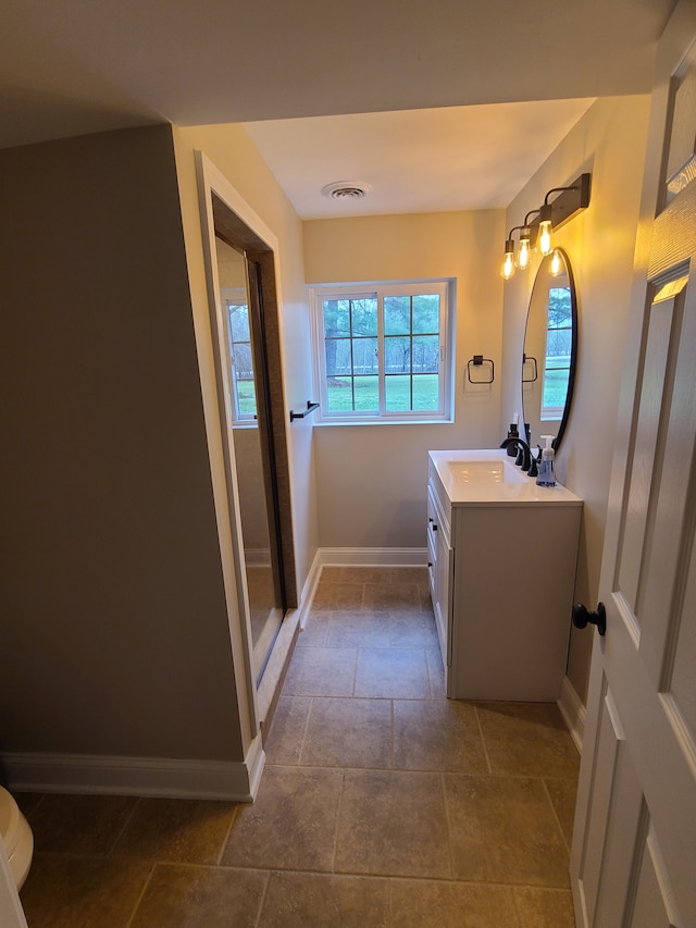 24800 Dayton Rd, Armada, MI 48005 - full bathroom featuring visible vents, stone finish floor, vanity, and baseboards