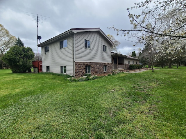 24800 Dayton Rd, Armada, MI 48005 - view of side of property featuring a yard and brick siding