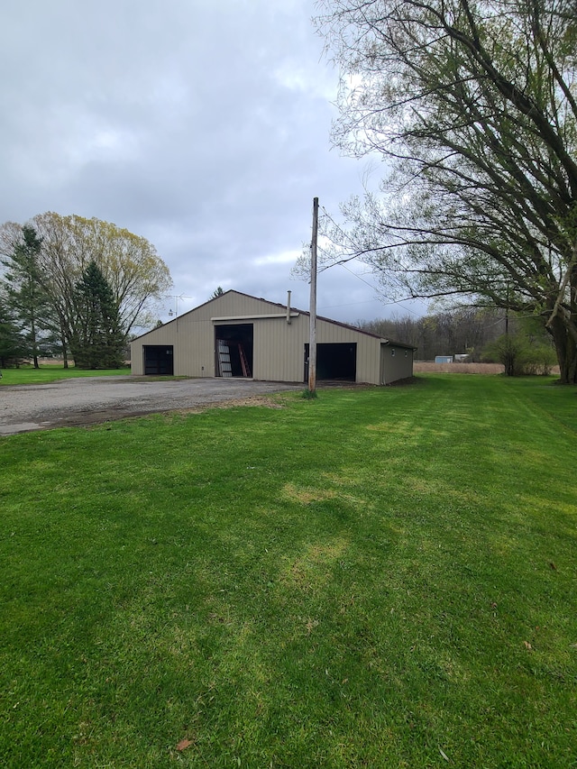 24800 Dayton Rd, Armada, MI 48005 - view of pole building featuring driveway and a yard