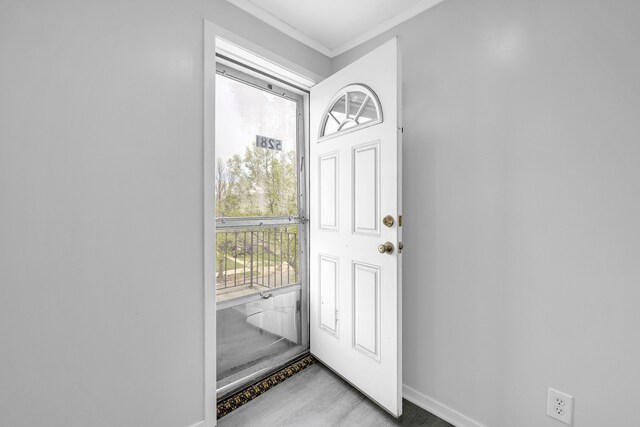 5281 Middlesex St, Dearborn, MI 48126 - doorway to outside featuring baseboards and crown molding