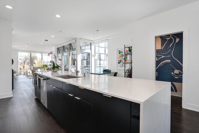 311 Alfred St, Detroit, MI 48201 - kitchen featuring dark cabinets, a sink, dark wood-style floors, open floor plan, and modern cabinets