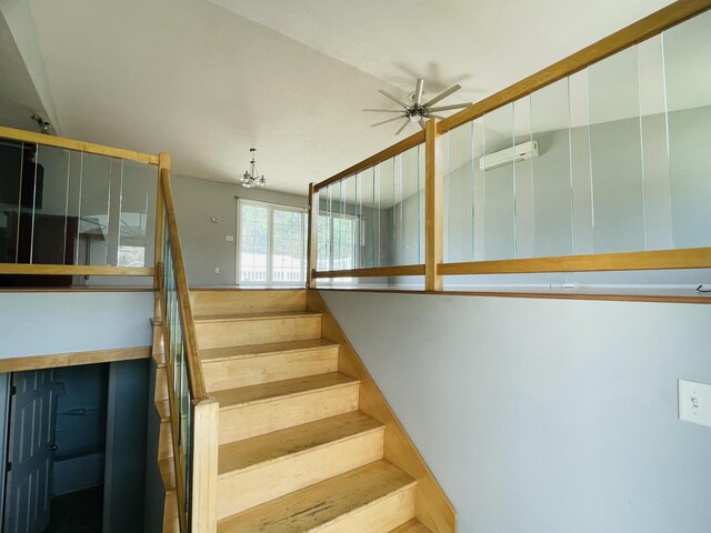 stairway with ceiling fan
