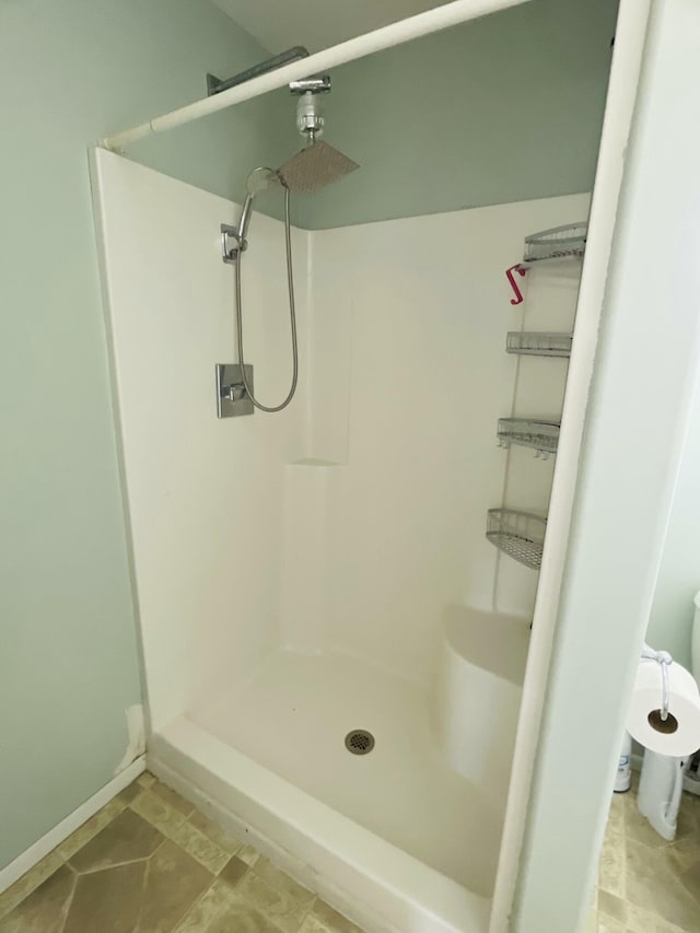 bathroom featuring a shower stall