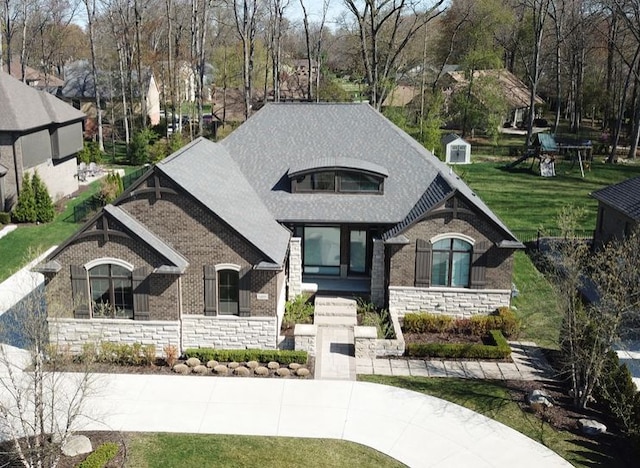 exterior space with stone siding