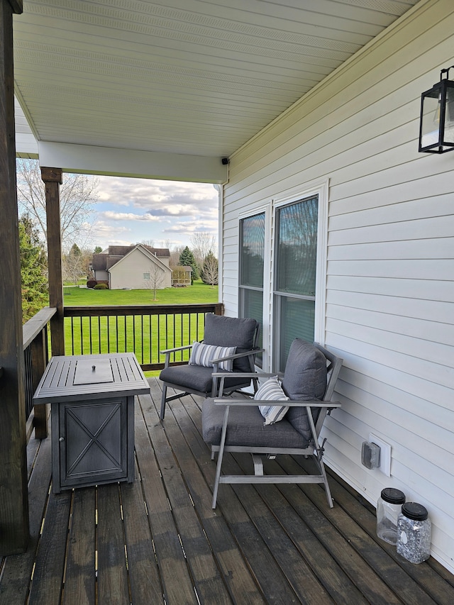 wooden deck with a yard