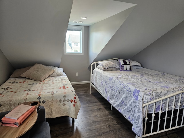 bedroom featuring dark wood finished floors, baseboards, and visible vents