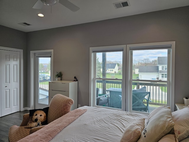 bedroom featuring visible vents, access to outside, dark wood-type flooring, and recessed lighting